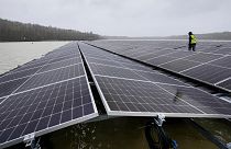 Solar panels are installed at a floating photovoltaic plant on a lake in Haltern, Germany, on April 1, 2022.