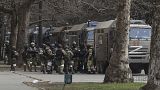 Russian army soldiers stand next to their trucks during a rally against Russian occupation in Svobody (Freedom) Square in Kherson, Ukraine, on March 7, 2022.