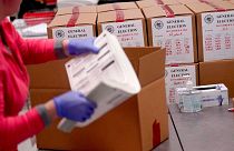 An election worker boxes tabulated ballots inside the Maricopa County Recorders Office, Wednesday, Nov. 9, 2022, in Phoenix.