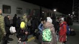 Kherson evacuees board trains at Crimea station in late October