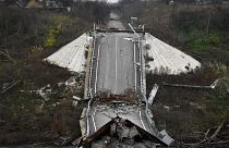 A destroyed bridge across Siverskyi-Donets river is seen in the recently recaptured village of Zakitne, Ukraine, Wednesday, Nov. 9, 2022