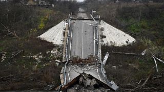 A destroyed bridge across Siverskyi-Donets river is seen in the recently recaptured village of Zakitne, Ukraine, Wednesday, Nov. 9, 2022
