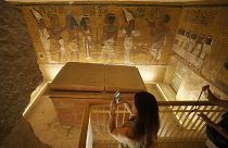 Visitors enter a replica of KV62, the tomb of Egypt's pharaoh Tutankhamun, discovered by British archaeologist Howard Carter and his Egyptian digging team.