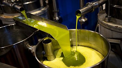 A tank is filled with olive oil at an oil mill in the southern town of Quesada, a rural community in the heartland of Spain's olive country, Oct. 27, 2022