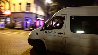 A police officer drives near the scene of a stabbing attack in Brussels, on November 10, 2022