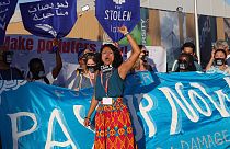 Climate activists stage a protest during the COP27 summit in Egypt's Red Sea resort city of Sharm el-Sheikh, on November 11, 2022.