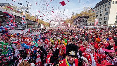 Revellers celebrate the start of the carnival season in the streets of Cologne, Germany.