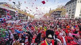 Carnival revellers celebrate at 11:11 with tens of thousands the start of the carnival season in the streets of Cologne, Germany,