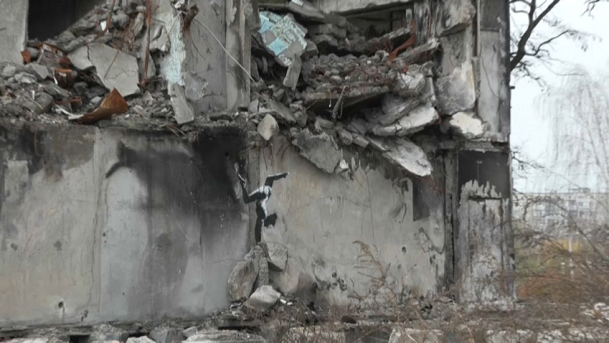 A Banksy mural on the side of a bombed-out building in Borodyanka, Ukraine