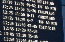 Cancellations and delays displayed on a departures board at Valencia airport, in southeastern Spain.