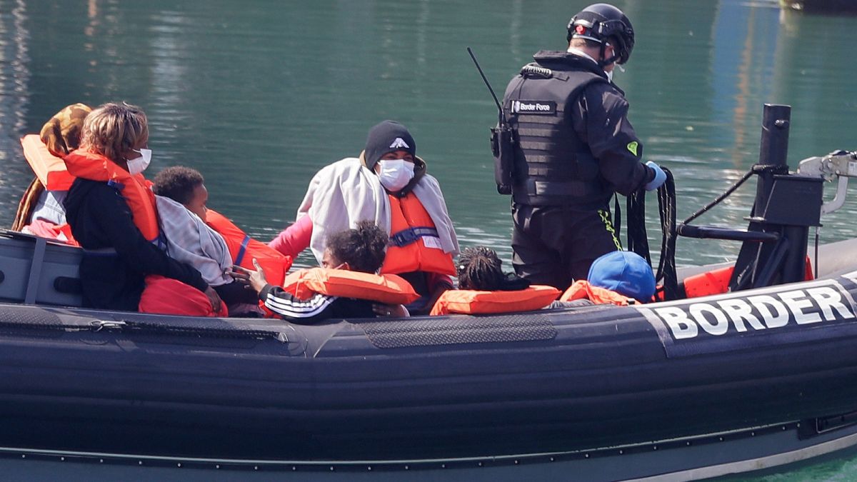 FILE: Migrants who crossed the Channel in a small boat rescued by UK authorities, Dover