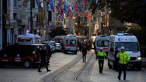 Police vehicles and ambulances are parked at the site of an explosion on Istanbul's popular pedestrian Istiklal Avenue in Istanbul, Turkey, Sunday, Nov. 13, 2022.