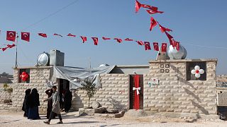 Turkish flags adorns the streets in Idlib's "Musiad" housing complex for displaced Syrians. Sunday Nov. 13, 2022
