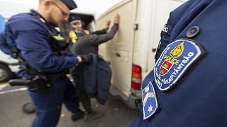 The suspected people smugglers fired shots at Hungarian police from a van carrying migrants on Monday.