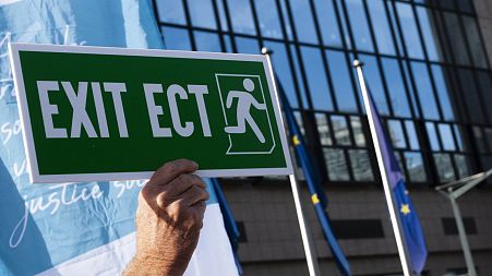 Protesters object to the Energy Charter Treaty in Brussels.
