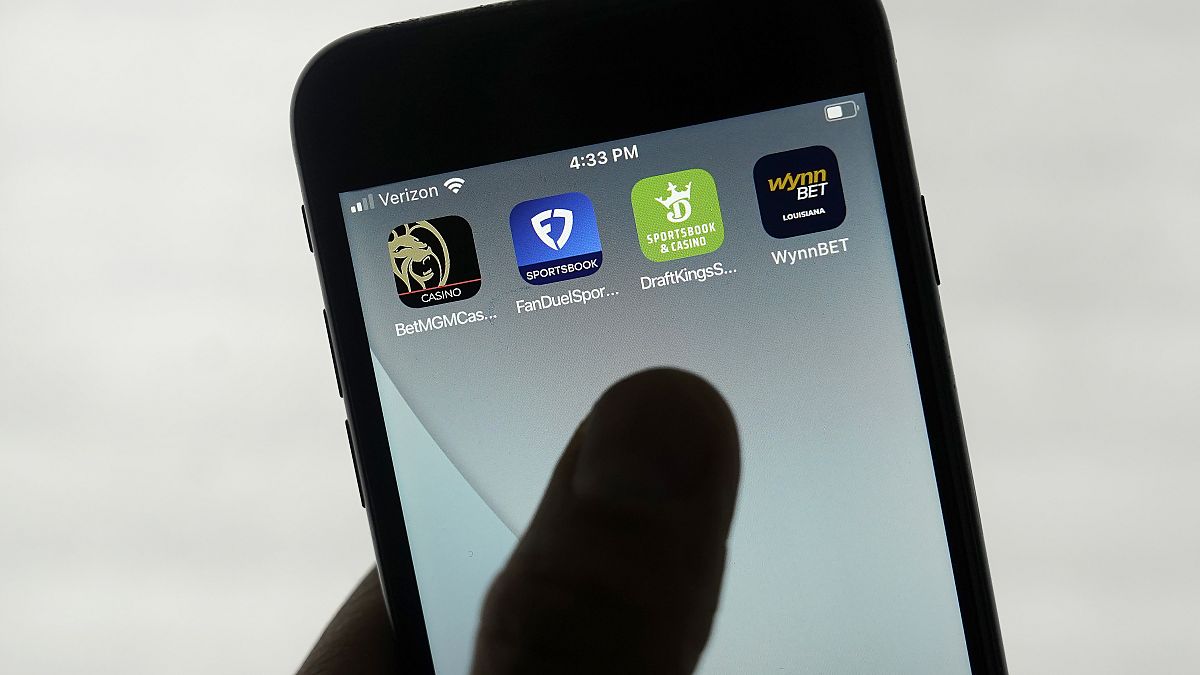 FanDuel, DraftKings and other online gambling apps are displayed on a phone in San Francisco, Monday, Sept. 26, 2022.