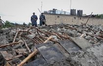 Kenyan police attend the scene of a building collapse in Ruaka, on the outskirts of the capital Nairobi.