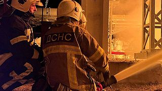 This photo taken on November 15, 2022 by Ukrainian Emergency Service, shows rescuers putting out a fire on critical infrastructure after missile strike to the Kyiv region.