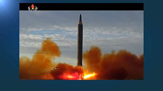 A TV screen shows a file image of North Korea's missile launch during a news program at the Seoul Railway Station in Seoul, South Korea, Friday, Nov. 18, 2022.