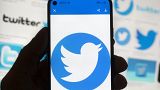 The Twitter logo is seen on a cell phone, Friday, Oct. 14, 2022, in Boston. The