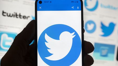 The Twitter logo is seen on a cell phone, Friday, Oct. 14, 2022, in Boston. The