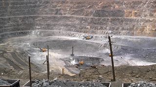 Workers use machinery to dig at a rare earth mine in the Baiyunebo mining district of Baotou in north China's Inner Mongolia Autonomous Region, Tuesday, July 6, 2010.