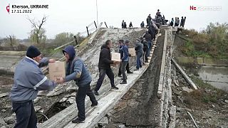Locals help distribute aid in Kherson