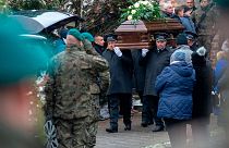 Pallbearers carry the coffin of Boguslaw Wos, one of two Polish men killed in a missile explosion, in Przewodow, Poland, Saturday, Nov. 19, 2022. 
