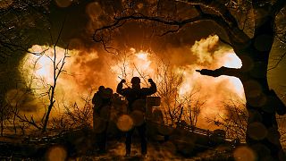 Ukrainian soldiers fire an artillery at Russian positions near Bakhmut, Donetsk region, Ukraine, Sunday, Nov. 20, 2022.