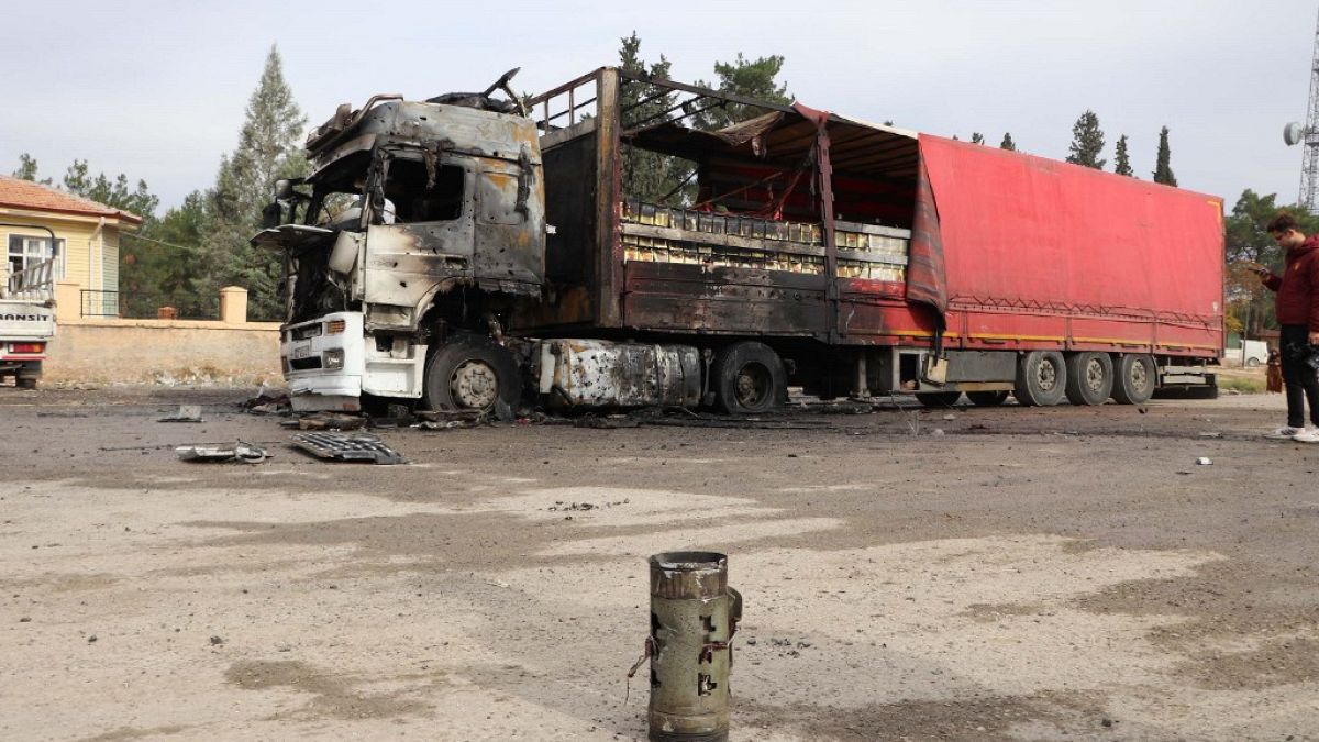 The wreckage of a burnt truck in Turkey after being hit by one of the rockets.