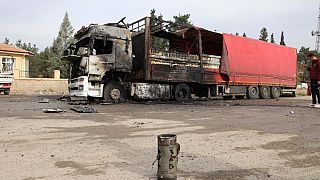 The wreckage of a burnt truck in Turkey after being hit by one of the rockets.