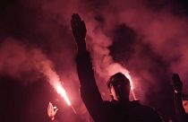 Manifestantes hacen el saludo fascista durante un acto por el 20-N en Madrid