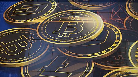 An advertisement of Bitcoin, one of the cryptocurrencies, is displayed on a building in Hong Kong, on 18 November 2021.
