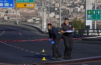 Israeli police inspect the scene of an explosion at a bus stop in Jerusalem, 23 November 2022
