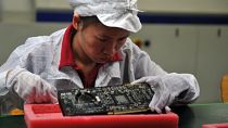 Une employée dans l'une des usines de fabrication d'Iphone de Foxconn - 26.05.2010