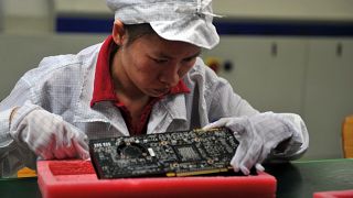 Une employée dans l'usine Foxconn de fabrication d'Iphone - 26.05.2010