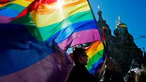 Gay rights activists carry rainbow flags as they march during a May Day rally in St. Petersburg, Russia, Wednesday, May 1, 2013. 
