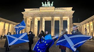 Scottish independence supporters stand at Brandenburg Gate, Berlin, 23 November 2022