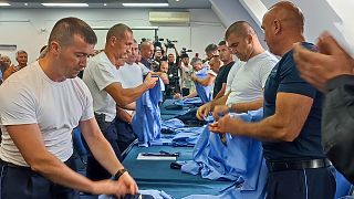 Serb police officers took off their uniforms in the town of Zvecan, Kosovo, Saturday, Nov. 5, 2022.