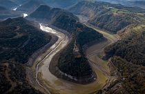 A view of Ter river running dry toward a reservoir near Vilanova de Sau, Catalonia, Spain, Wednesday, Nov. 23, 2022.