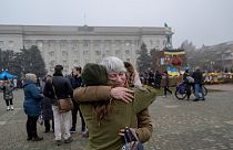 A woman hugs her friend who is a soldier in Ukraine army on November 21, 2022, in Kherson, amid the Russian invasion of Ukraine.