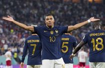 France's Kylian Mbappe celebrates scoring his side's opening goal against Denmark during their World Cup group D match in Doha, Qatar, Saturday, Nov. 26, 2022.