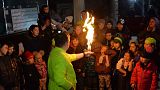 An entertainer performs for children at a volunteer centre during the partial blackout in the eastern Ukrainian city of Kharkiv on November 26, 2022.