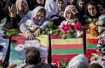 Syrian Kurds attend a funeral of people killed in Turkish airstrikes in the village of Al Malikiyah , northern Syria, Monday, Nov. 21, 2022