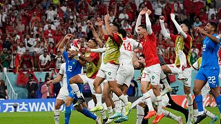 Morocco players celebrate after the World Cup group F soccer match between Belgium and Morocco, at the Al Thumama Stadium in Doha, Qatar, Sunday, Nov. 27, 2022.