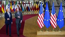 President Joe Biden walks with European Council President Charles Michel during an EU summit at the European Council building in Brussels, Thursday, March 24, 2022. 