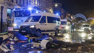 Police had to seal off parts of Brussels and moved in with water cannons and tear gas to disperse crowds.