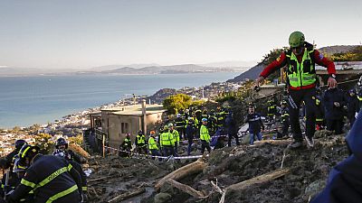 Rescuers work after heavy rainfall triggered landslides that collapsed buildings, in Casamicciola, on the southern Italian island of Ischia.