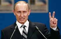 Russian President Vladimir Putin gestures as he addresses the media during a press conference on the third day of the NATO Summit conference in Bucharest, Friday April 4 2008.
