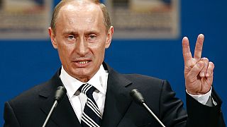 Russian President Vladimir Putin gestures as he addresses the media during a press conference on the third day of the NATO Summit conference in Bucharest, Friday April 4 2008.